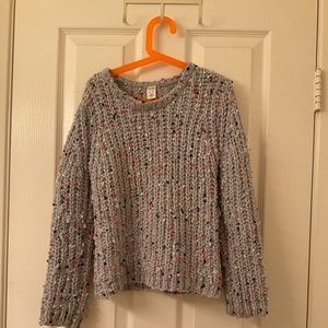 This is a light blue kids sweater it has rainbow poke a dots super soft!